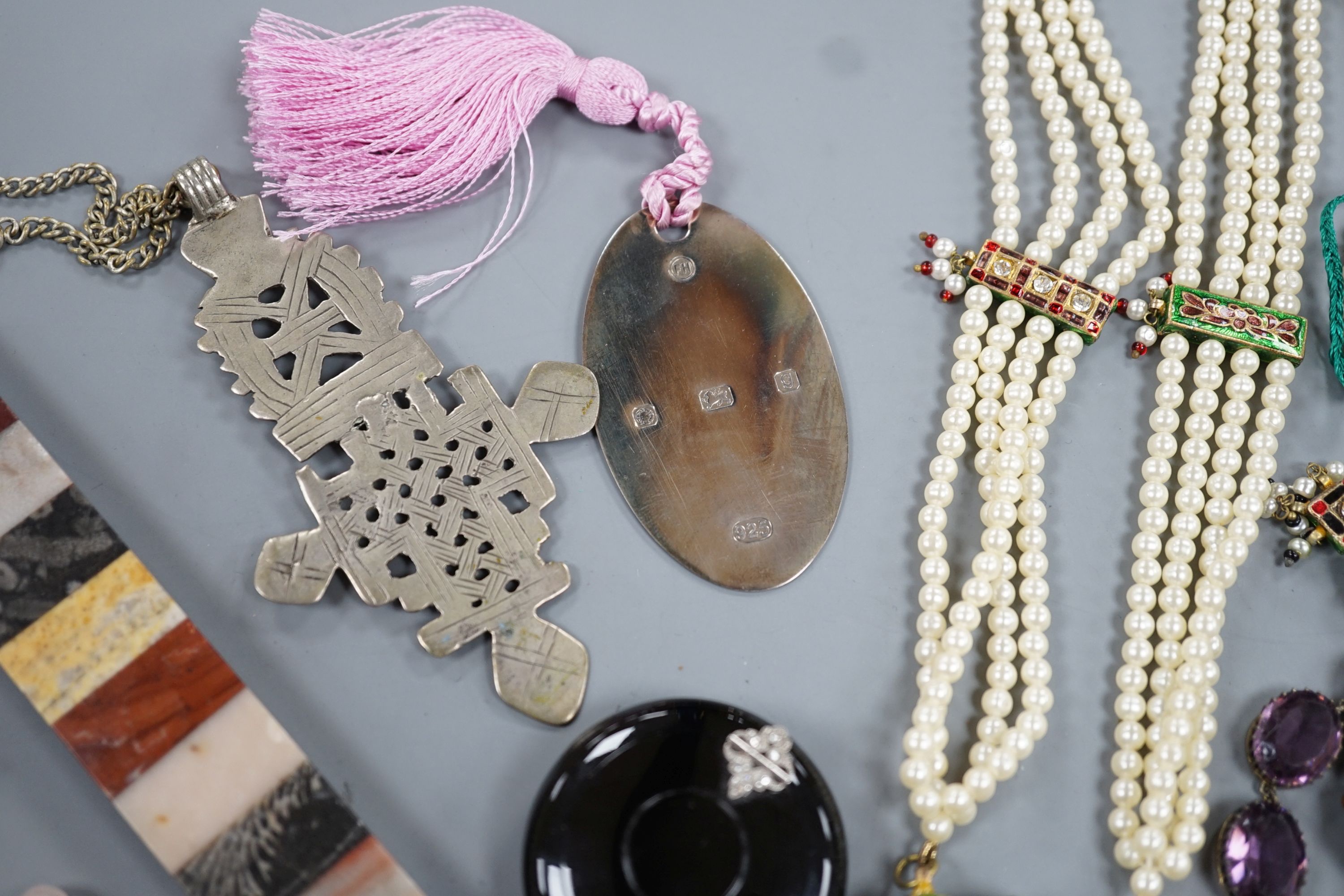 An early 20th century French white metal and diamond chip set tortoiseshell? circular pill box, maker's mark for Michel Ballada, 42mm and a small quantity of assorted jewellery.